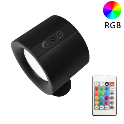 Black LED lamp with RGB color options and remote control on a white background