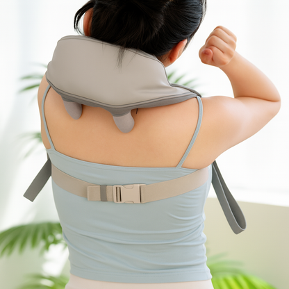 Person using a neck and shoulder massager with a blurred background