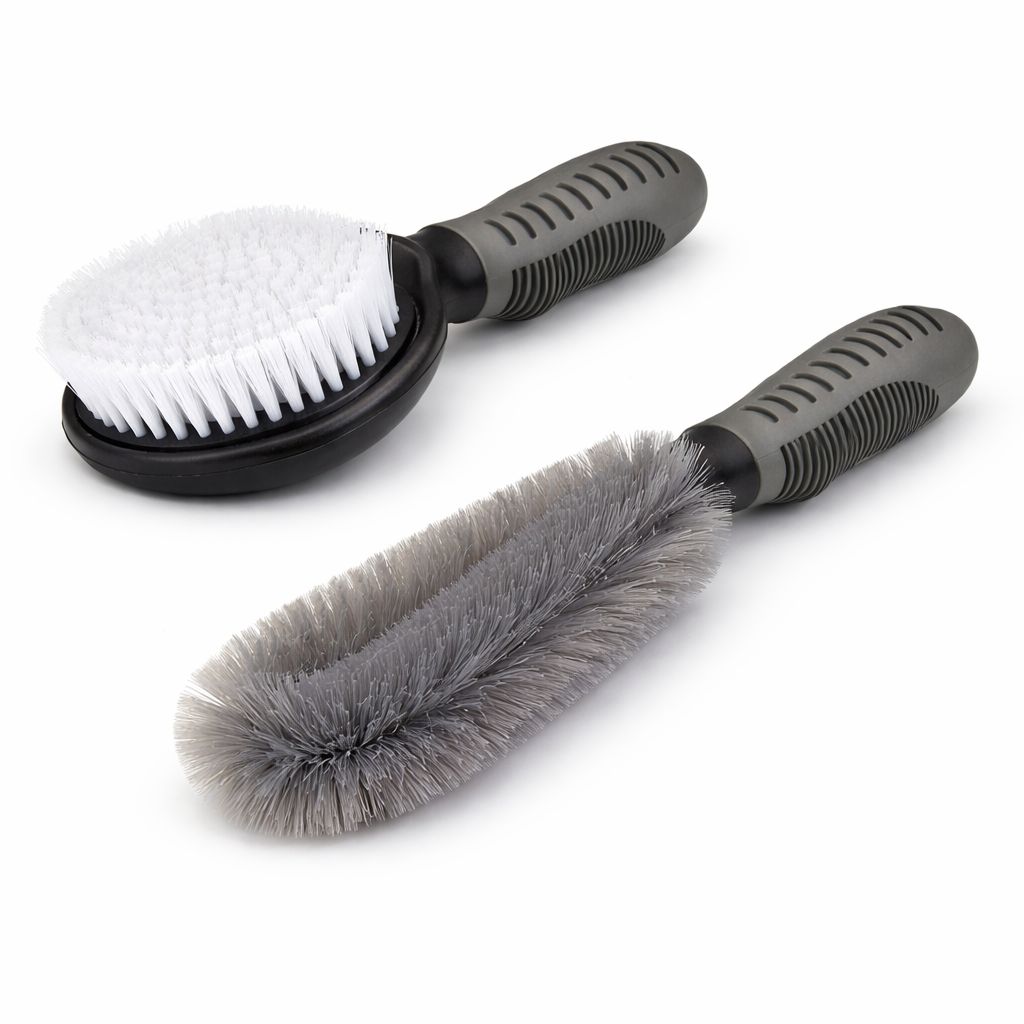 Two cleaning brushes with white bristles and gray bristles on a white background
