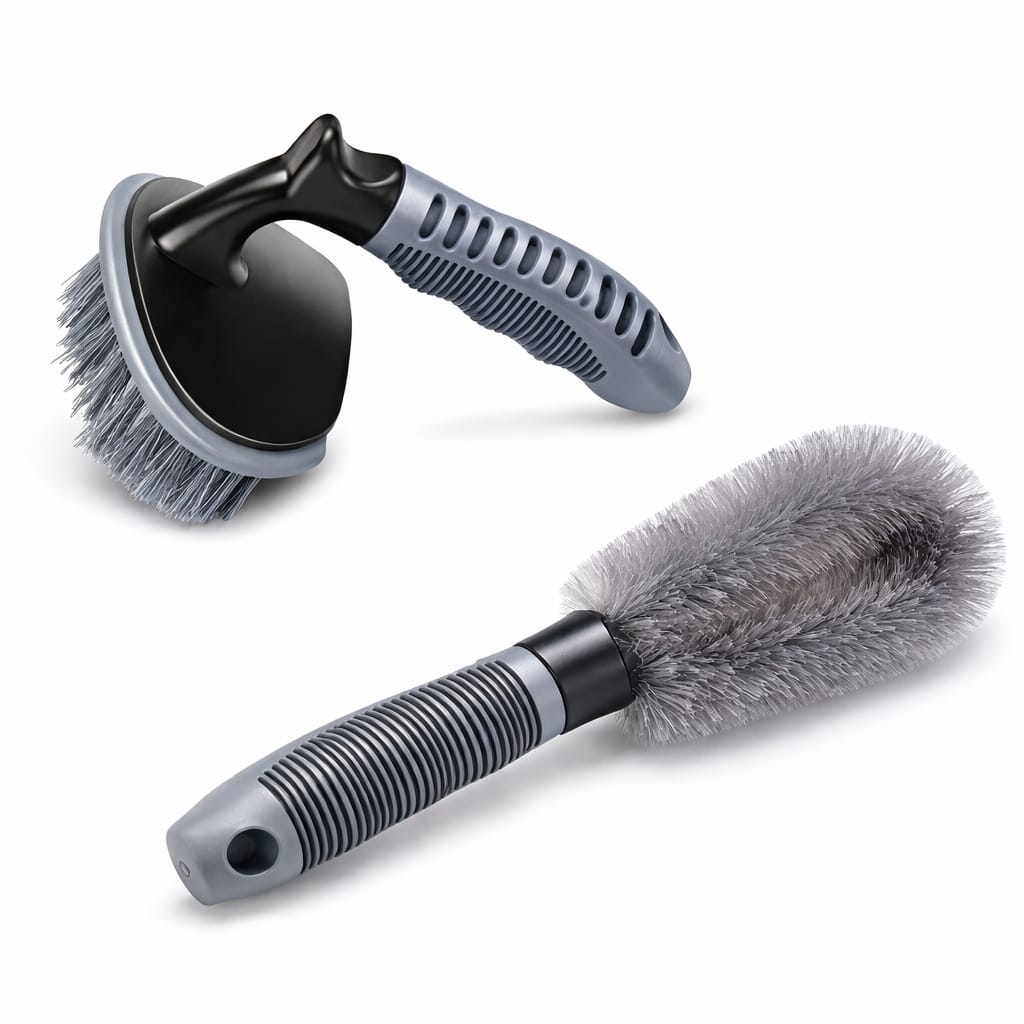 Two car cleaning brushes with gray bristles on a white background
