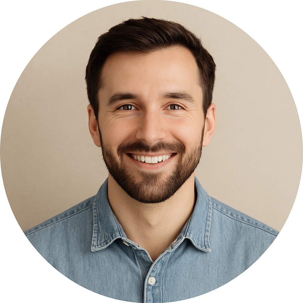 Man with a beard and blue shirt against a beige background