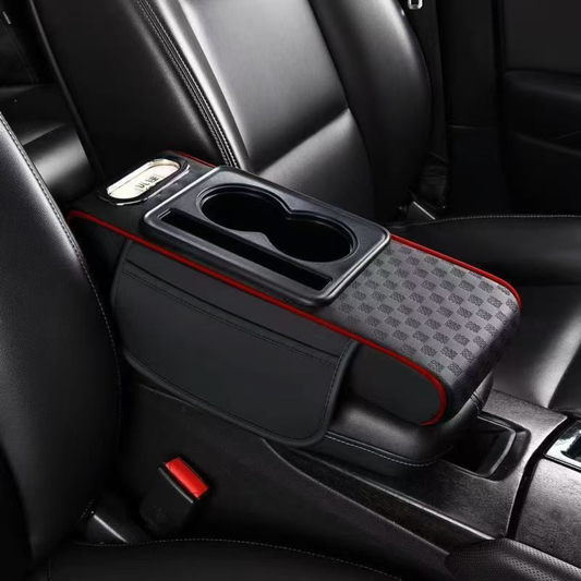 Black Car armrest organizer with cup holder and storage space in a vehicle interior.