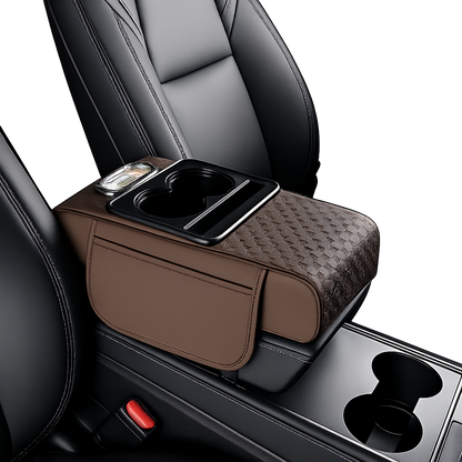 Brown car armrest organizer with cup holder and storage pocket on a car seat.