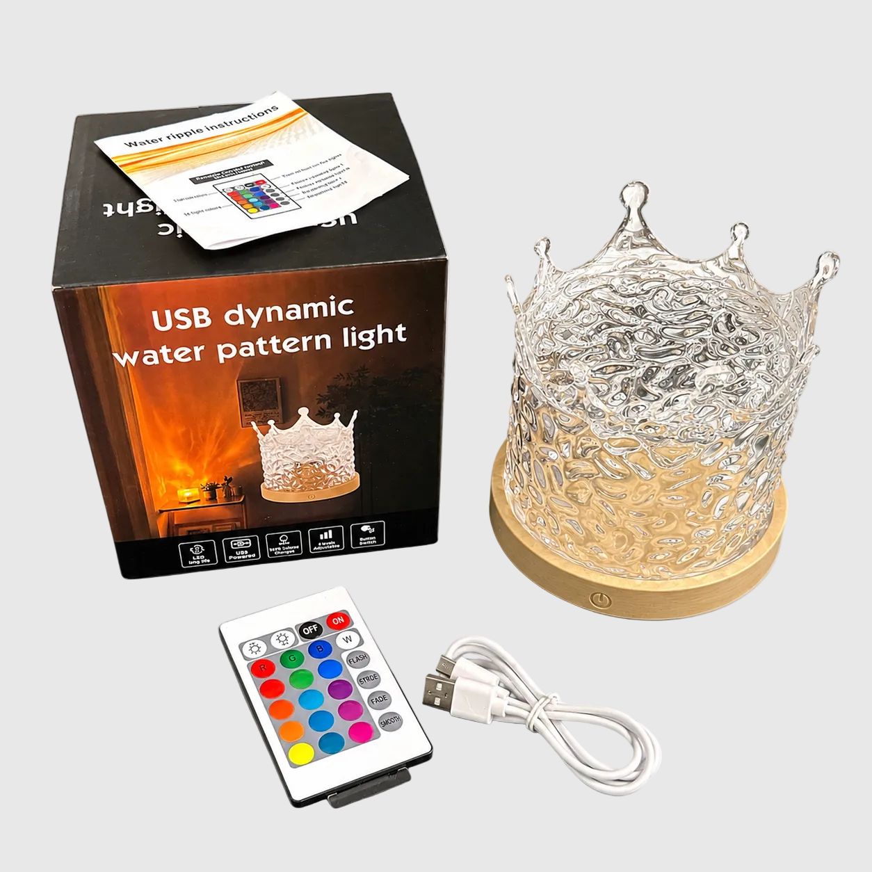 crown_aurora_galaxy USB dynamic water pattern light with packaging, remote control, and cable on a white background