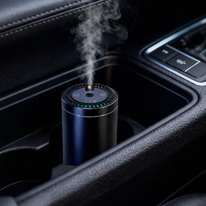 Car air freshener with mist emitting from it, placed in a car's cup holder.