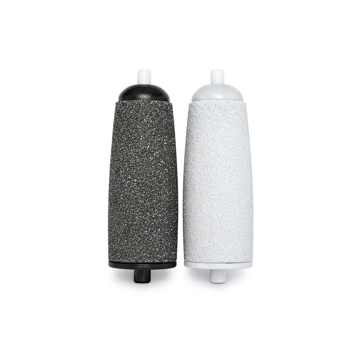 Two cylindrical objects, one black and speckled, the other white, on a white background.