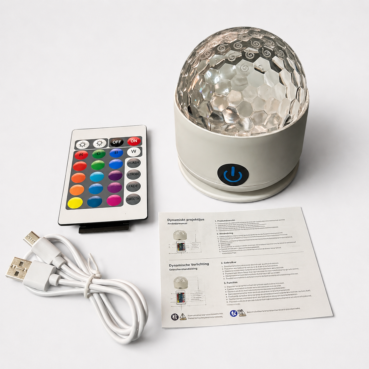 honeycomb design light with remote control, USB cable, and user manual on a white background