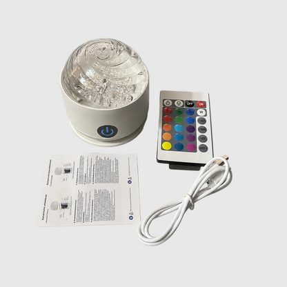 spiral design Color-changing LED light with remote control, power cord, and user manual on a white background